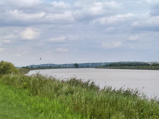 The River Trent near Gunness, England, with a wind farm on the horizon