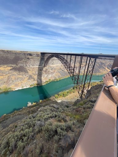 The Snake River in its canyon below a steel arch bridge, Idaho, USA